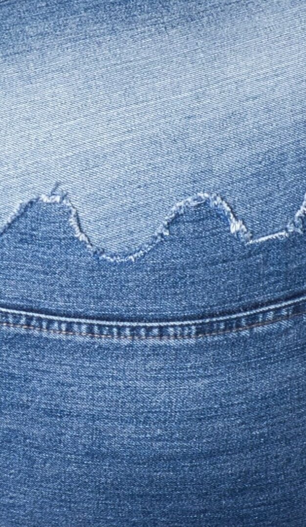 Model in upcycled denim top